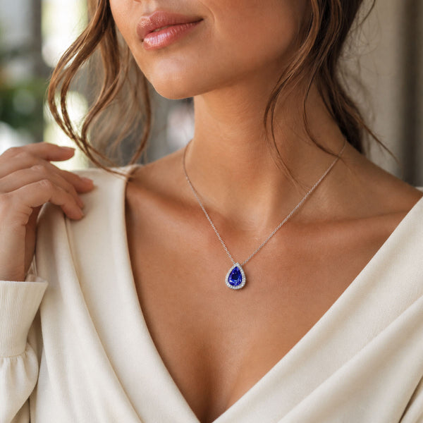 Berry's 18ct White Gold Pear Cut Tanzanite And Diamond Halo Pendant - Berry's Jewellers