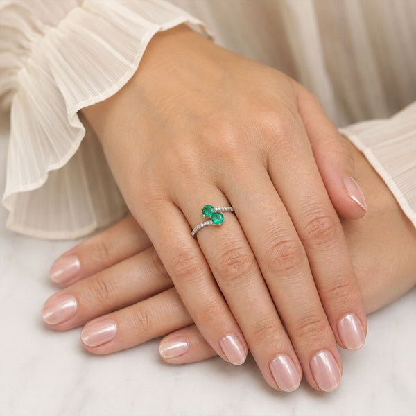 Berry's Platinum Round Brilliant Cut Emerald Two Stone Twist Ring With Diamond Set Shoulders - Berry's Jewellers