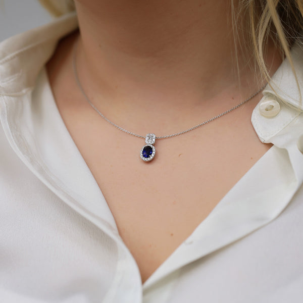Berry's 18ct White Gold Oval Sapphire And Diamond Double Halo Pendant - Berry's Jewellers