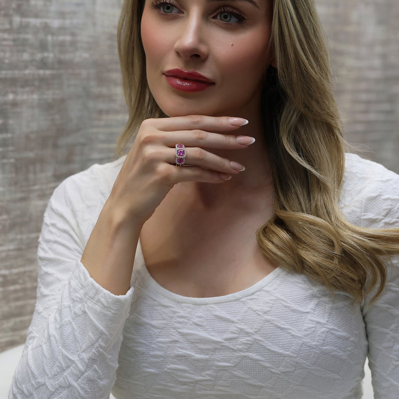 18ct Rose Gold Cushion Cut Pink Sapphire Three Stone Ring In A Diamond Halo Setting