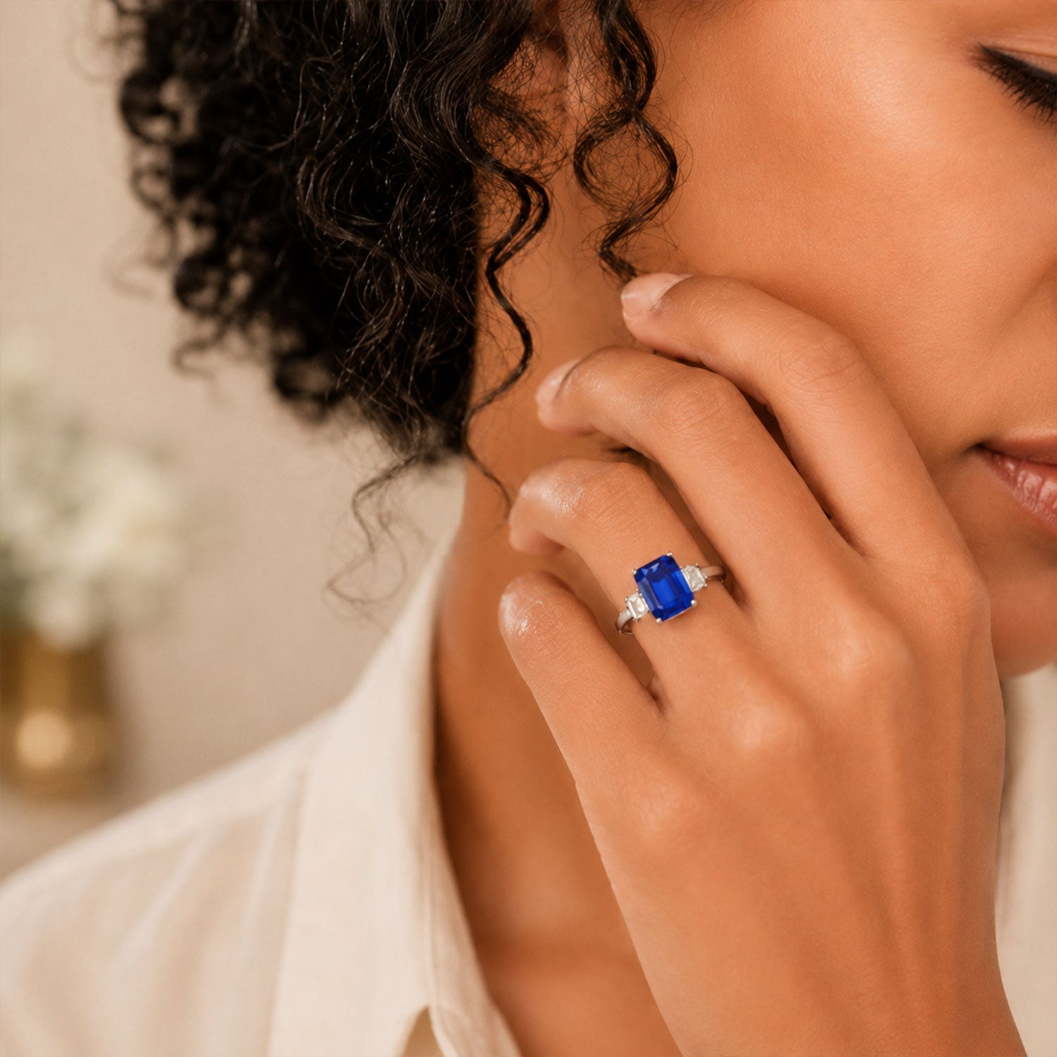 Berry's Platinum Emerald Cut Tanzanite and Baguette Cut Diamond Three Stone Ring - Berry's Jewellers