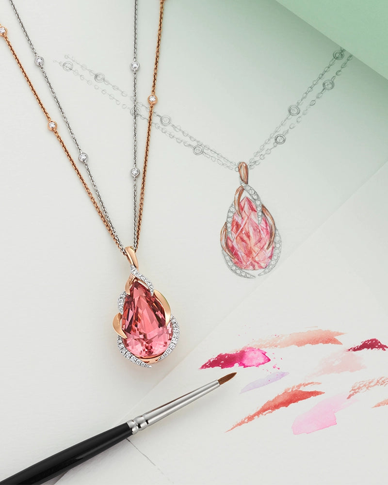 Pink gemstone Berry's bespoke pendant shown alongside original design sketches