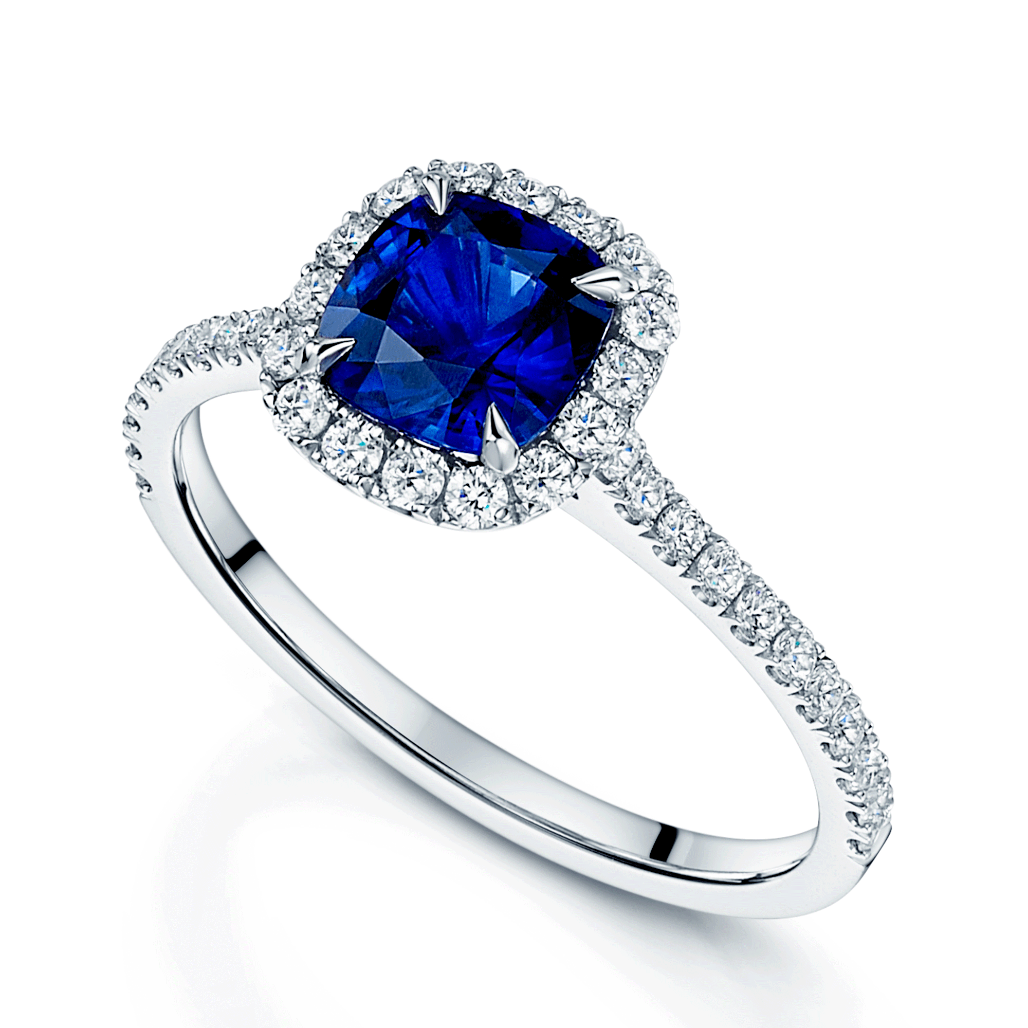 Platinum Cushion Cut Sapphire And Diamond Halo Cluster Ring With Diamond Shoulders.