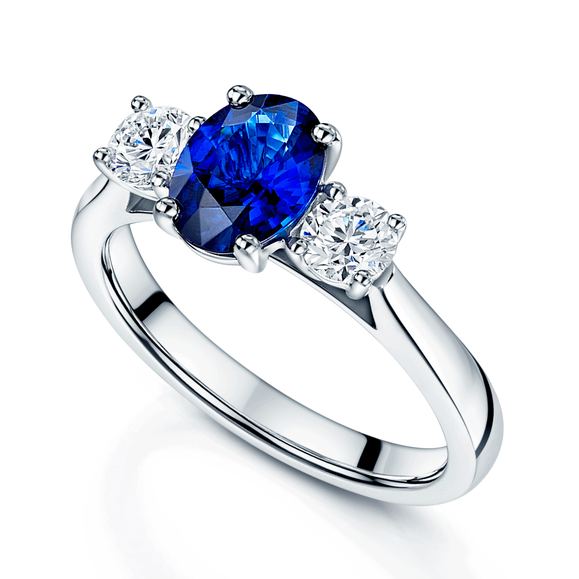 Platinum Oval Cut Sapphire Three Stone Ring With Two Round Brilliant Cut Diamonds