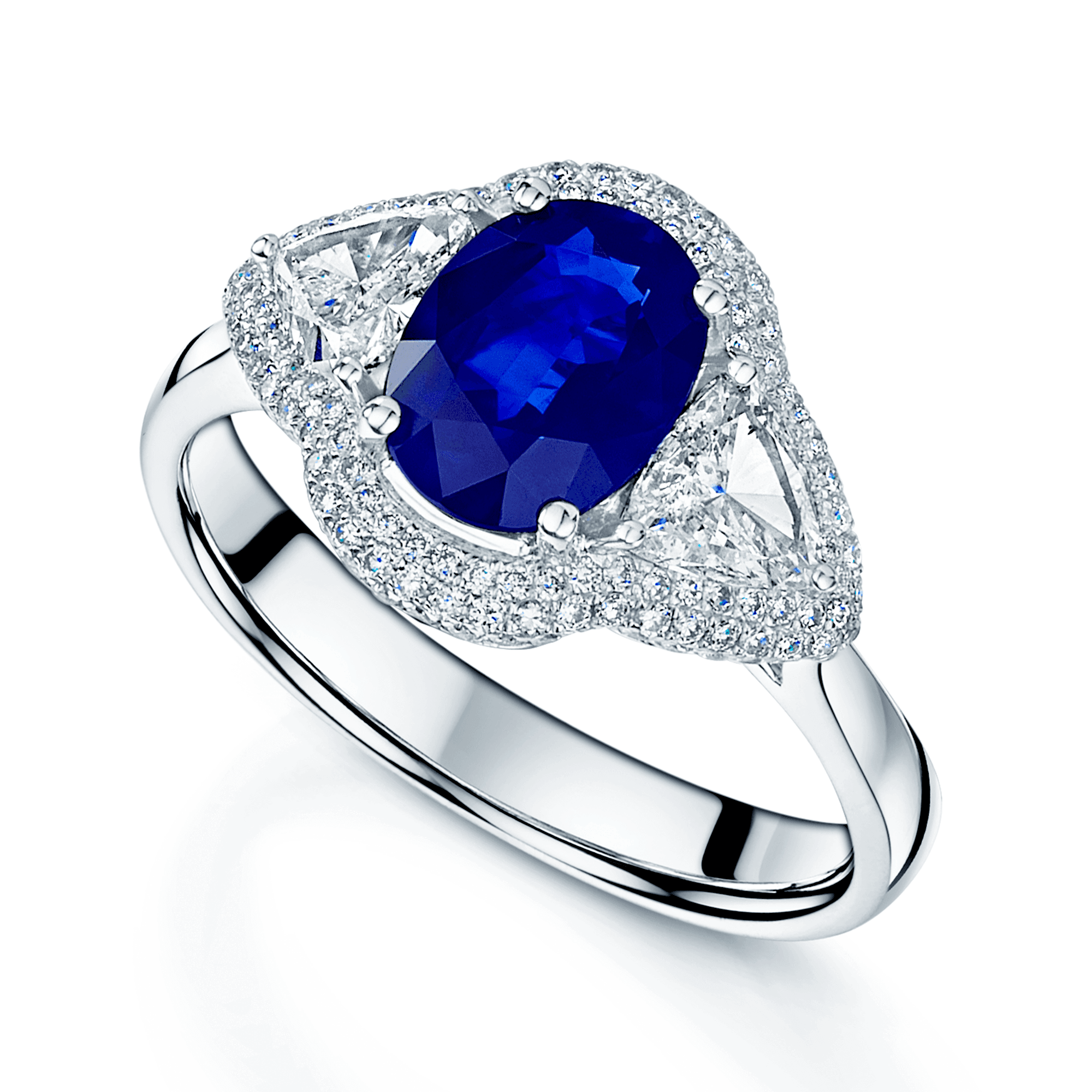 Platinum Oval Sapphire And Trilliant Cut Diamond Fancy Cluster Ring With Round Brilliant Diamond Surround