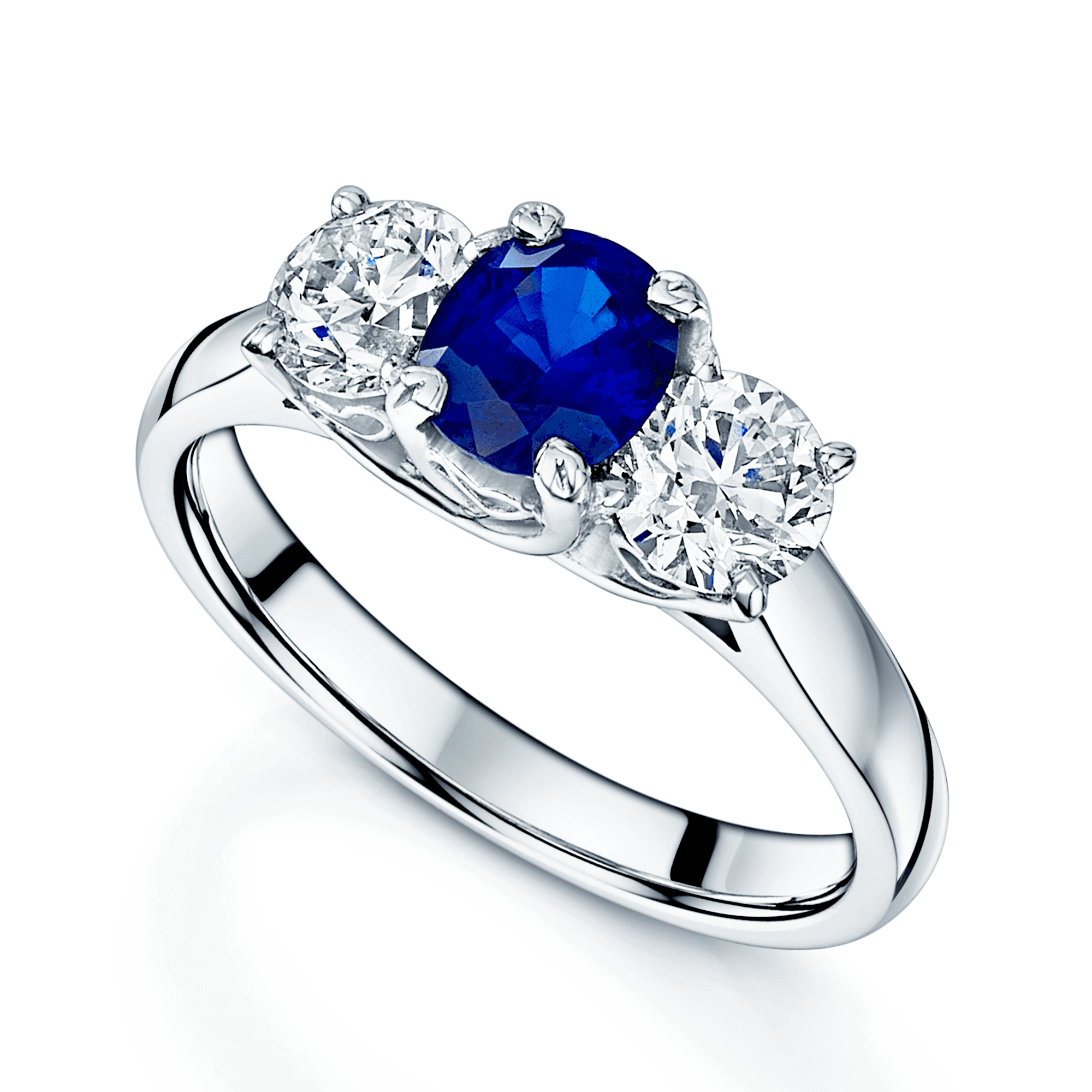 18ct White Gold Oval Unheated Sapphire And Round Brilliant Cut Diamond Three Stone Ring