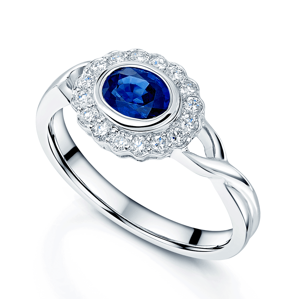 18ct White Gold Blue Sapphire and Brilliant Cut Diamond Rub Over Cluster Ring