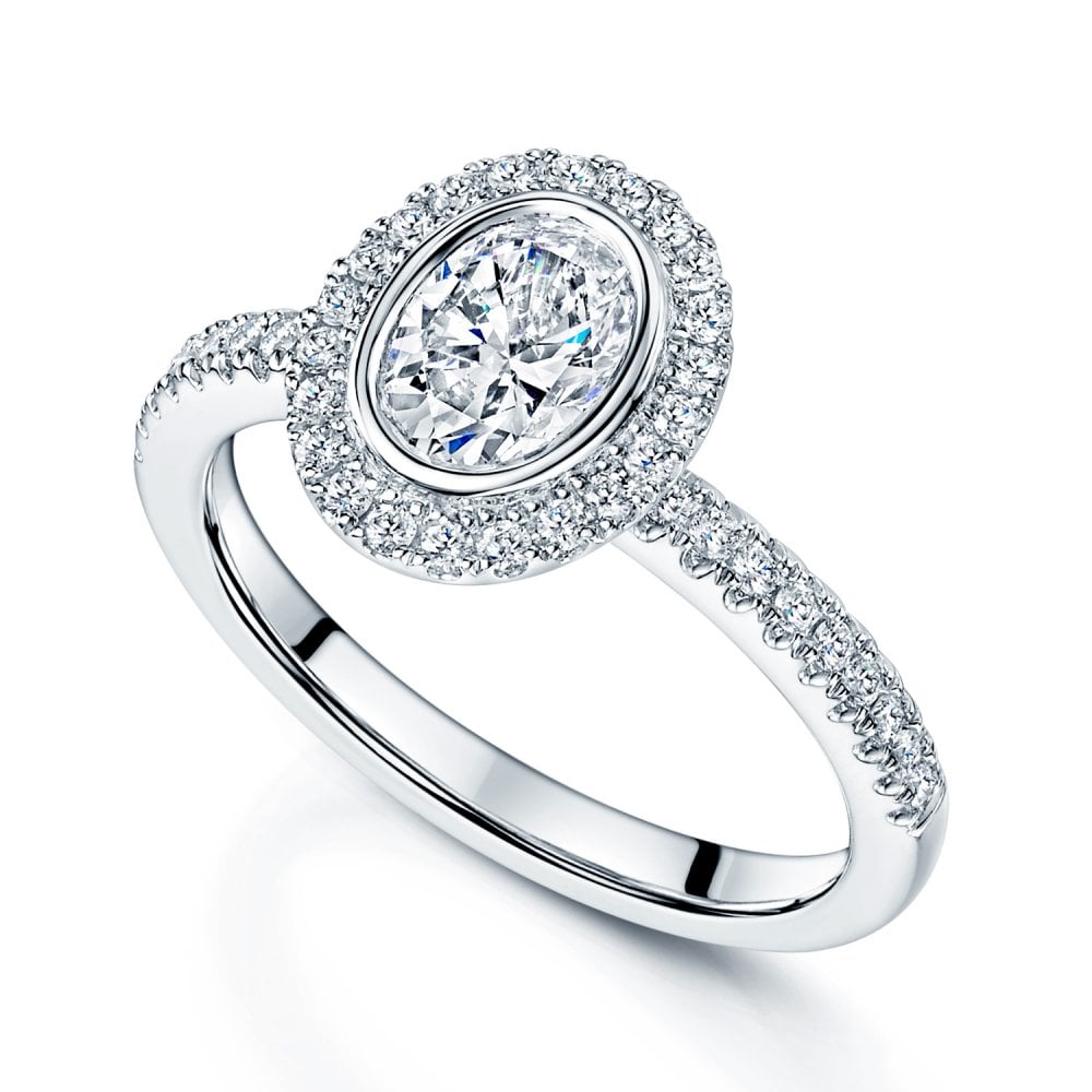 Platinum GIA Certificated Oval Cut Diamond Ring With A Halo Surround And Diamond Shoulders