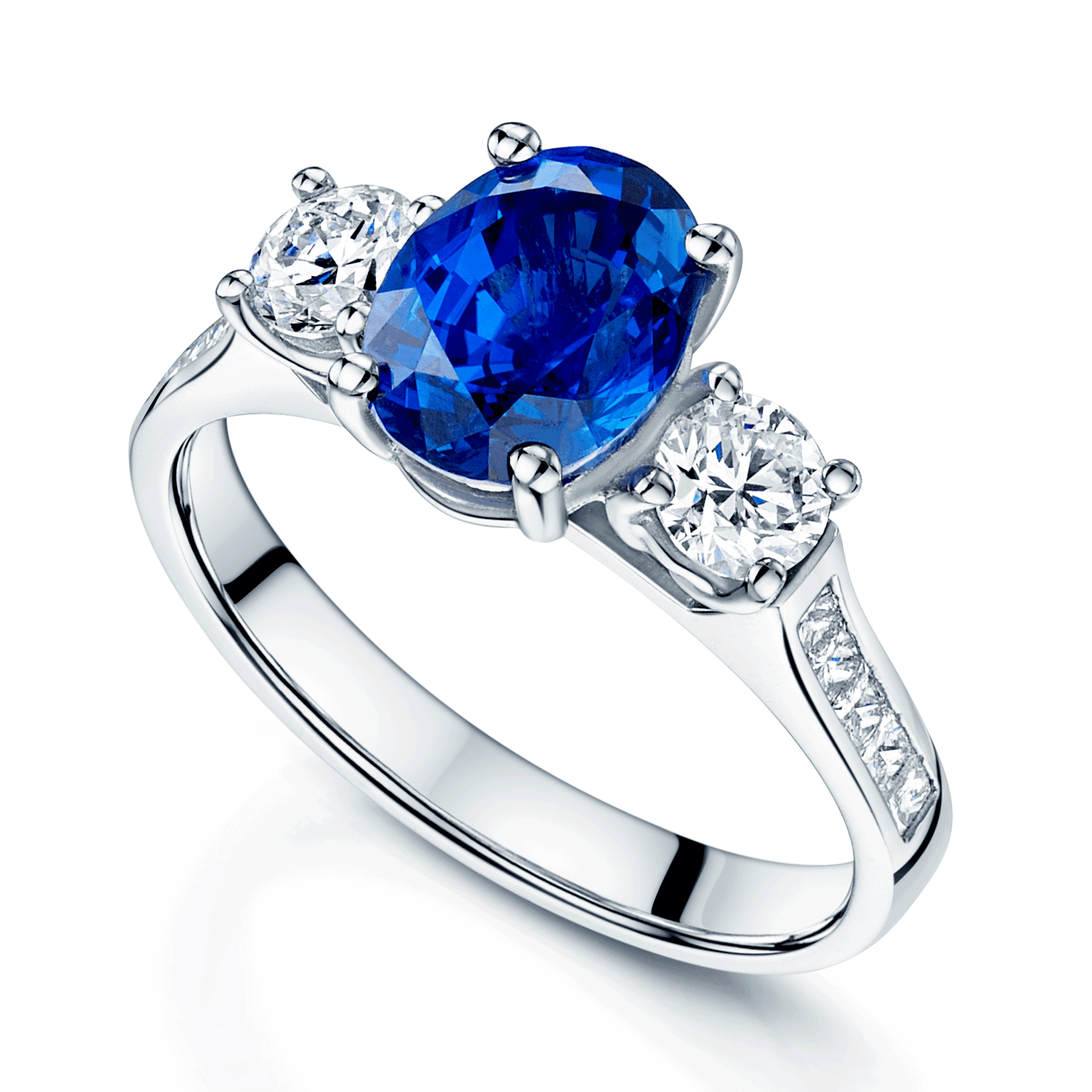Platinum Oval Sapphire & Diamond Three Stone Ring With Channel Set Diamond Shoulders