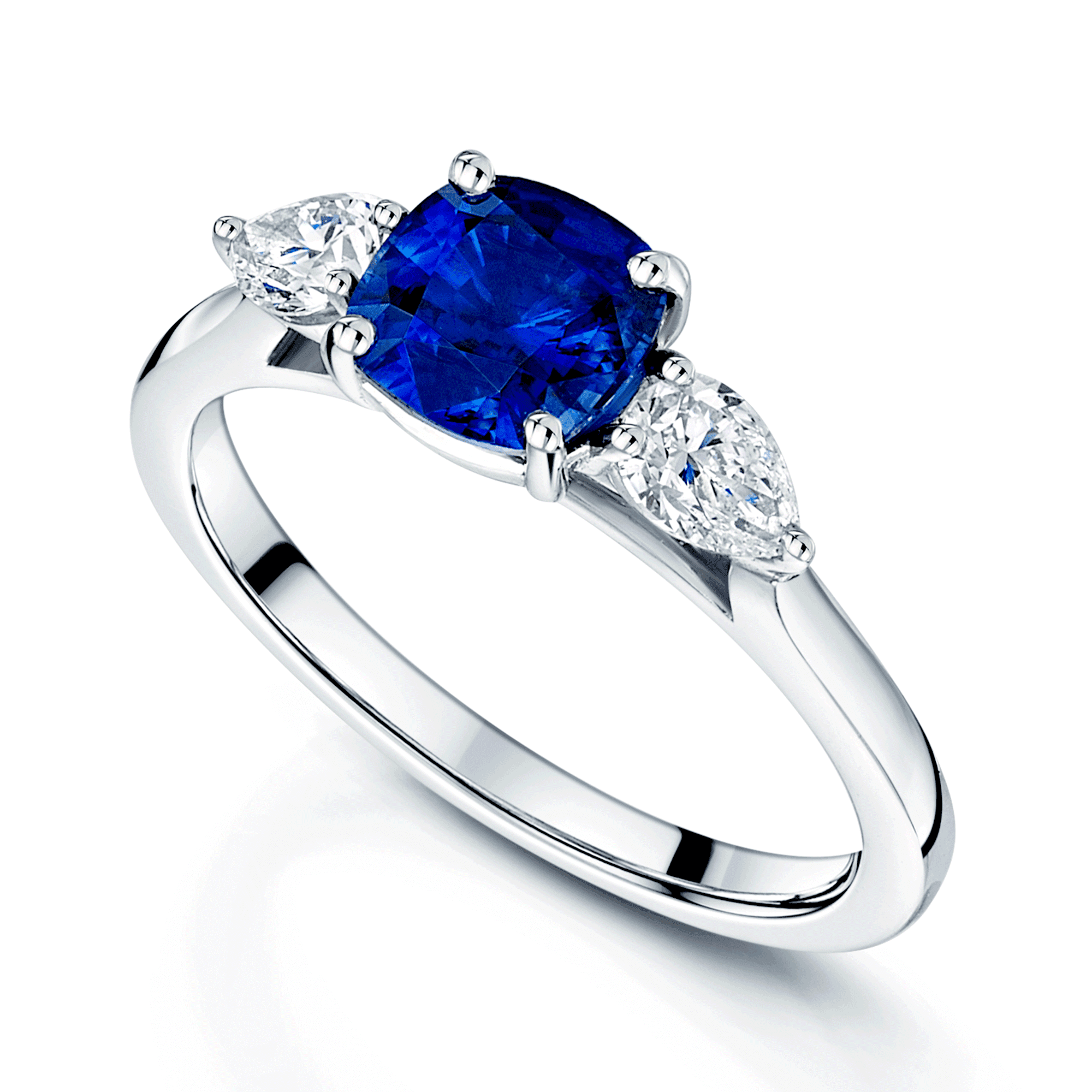 Platinum Cushion Cut Blue Sapphire & Pear Cut Diamond Three Stone Ring