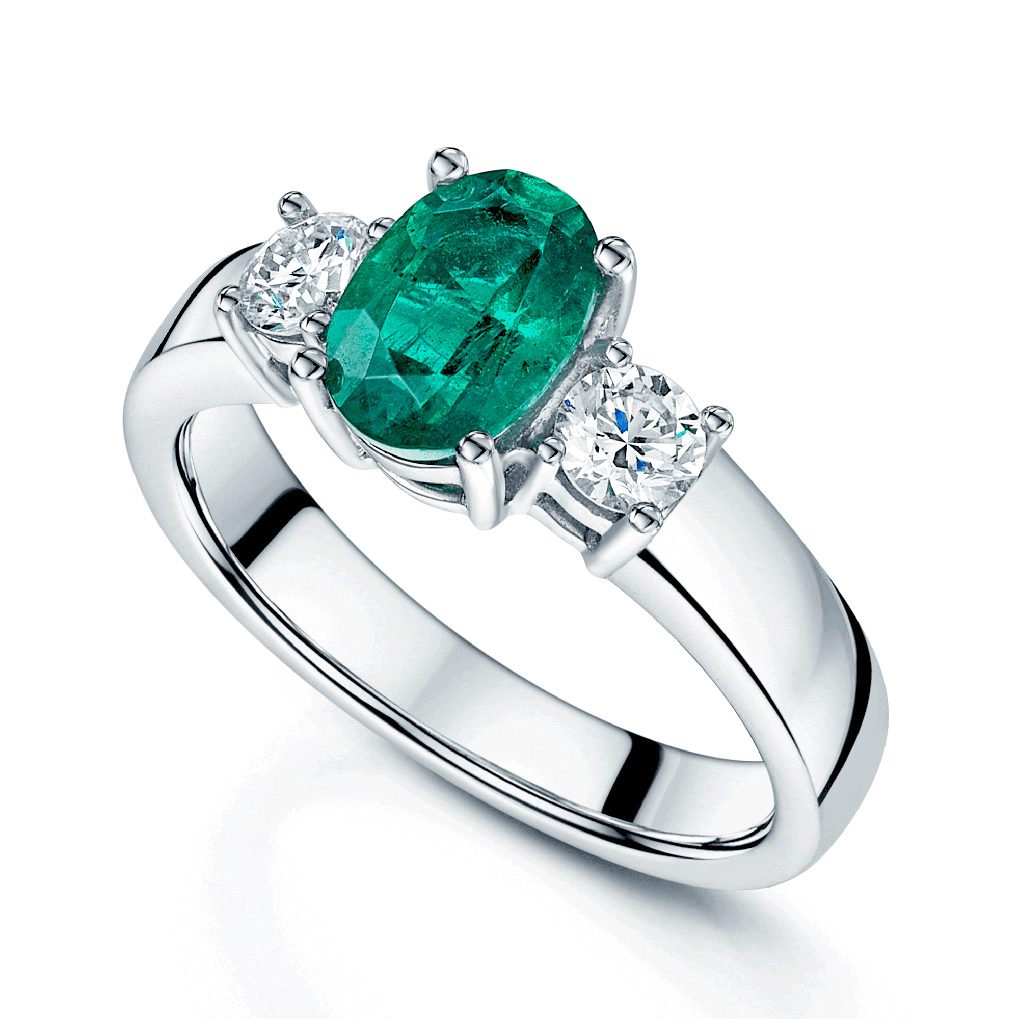 Platinum Oval Cut Emerald & Round Brilliant Cut Diamond Claw Set Three Stone Ring
